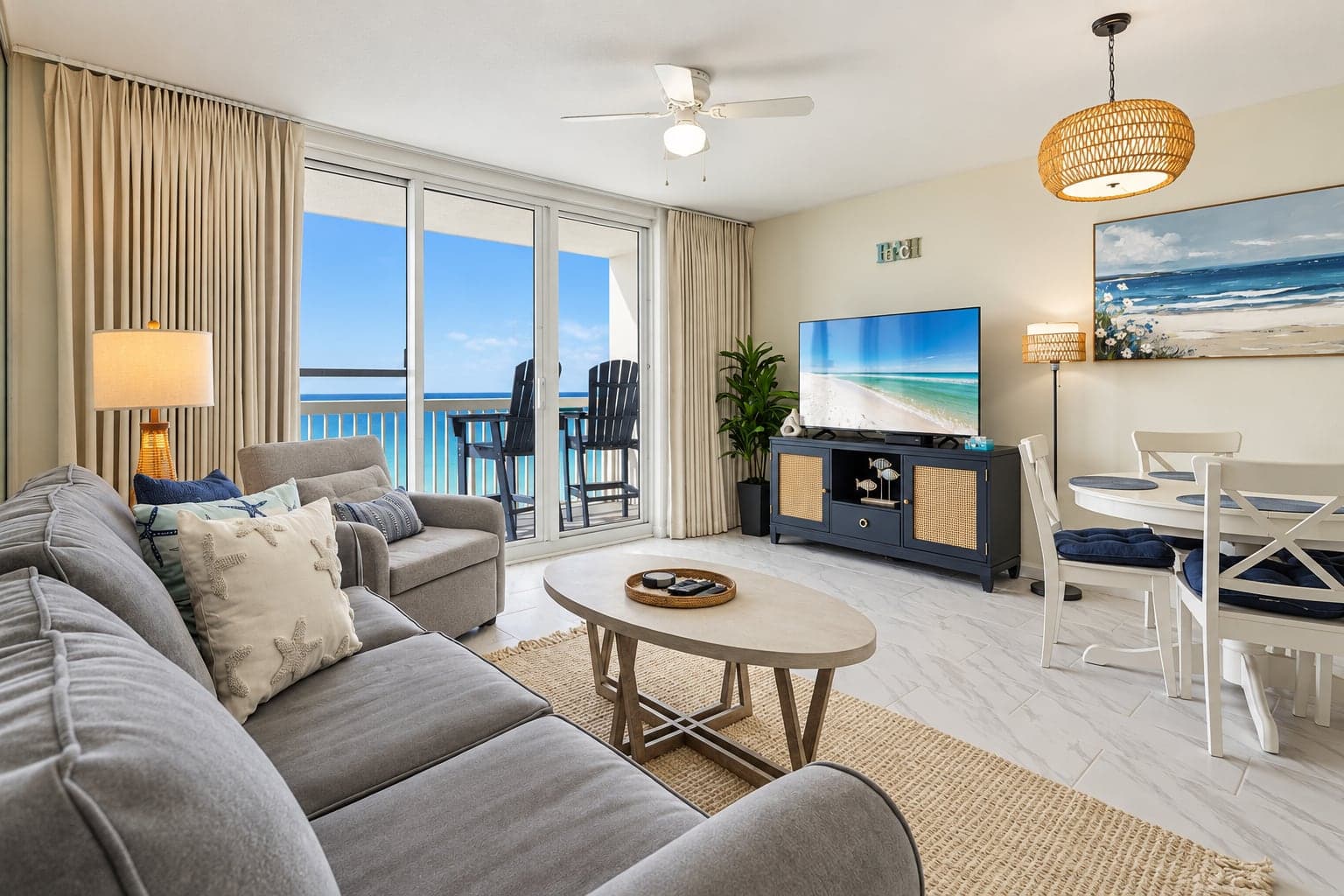 Living room of a Destin beach condo with the Gulf through the balcony doors