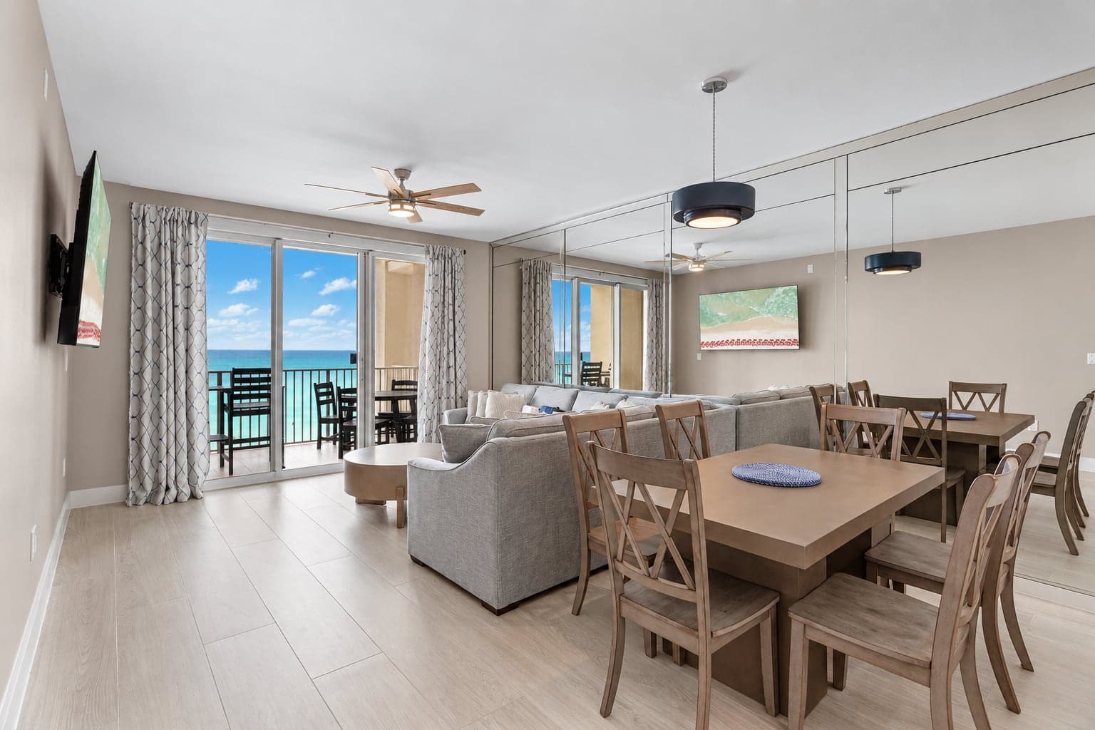 Living and dining area of a gulf-front condo after a complete remodel